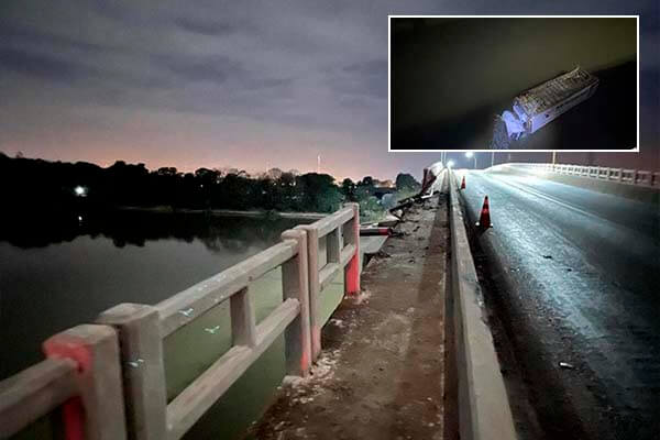 Caminhão rompe barreira, cai de ponte e homem fica ferido em Cáceres; veja vídeo